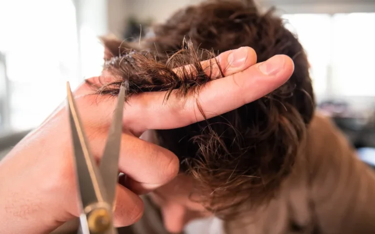 Hairdresser giving a client a haircut at a local salon