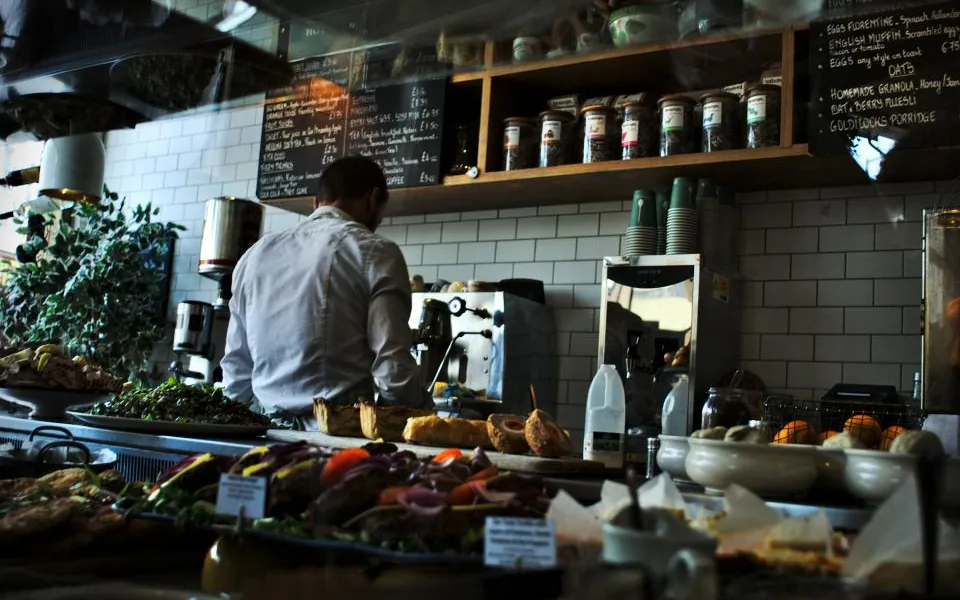 Restaurant owner working behind the counter
