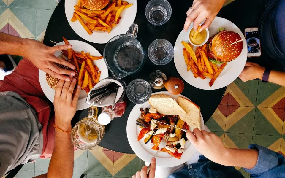 Happy customers sharing a meal at a local restaurant